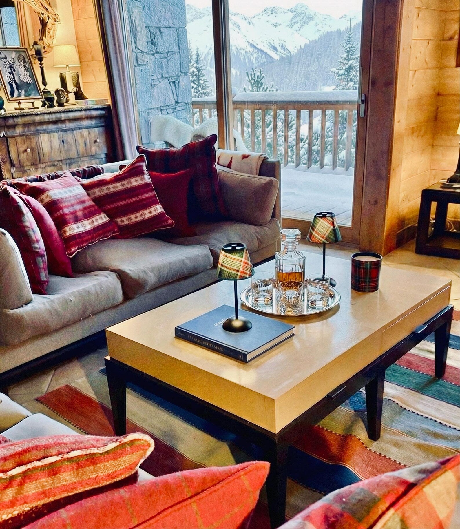 A grand ski chalet dining tablescape featuring four Aspen plaid shades on cordless lamp bases for a cozy, upscale atmosphere.