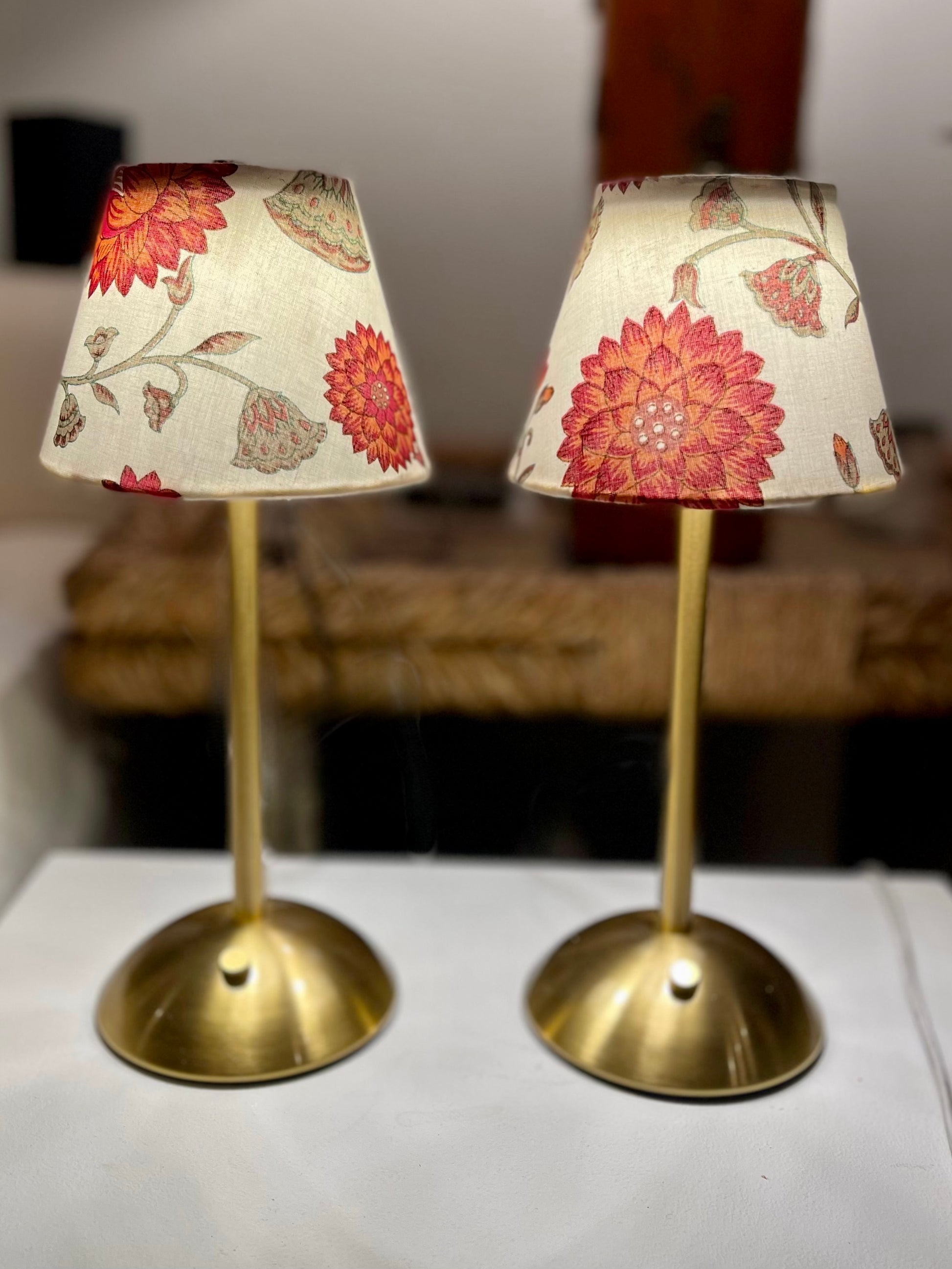 Two Nandina Lamp Shades displayed side by side on gold cordless table lamps, enhancing a warm and inviting home decor.