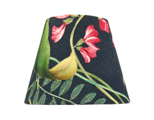 Close-up of The Noir Lamp Shade for cordless lamps , a handmade cotton shade with a black background and vibrant floral botanical design