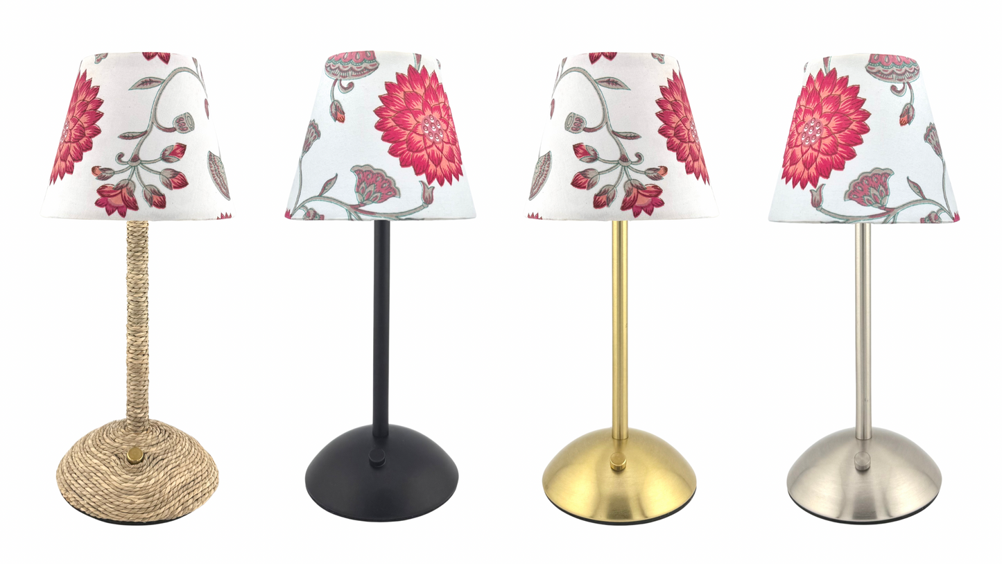 The Nandina Lamp Shade displayed on four different cordless table lamps—gold, black, silver, and seagrass—highlighting its compatibility with various lamp bases.